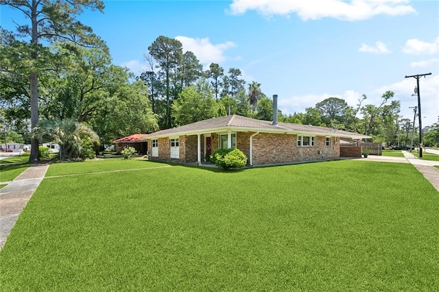 1207 Cousin St, Slidell, LA 70458 - single story home with a front lawn, driveway, and brick siding