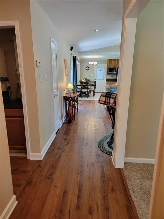 1207 Cousin St, Slidell, LA 70458 - corridor featuring a chandelier, wood finished floors, and recessed lighting