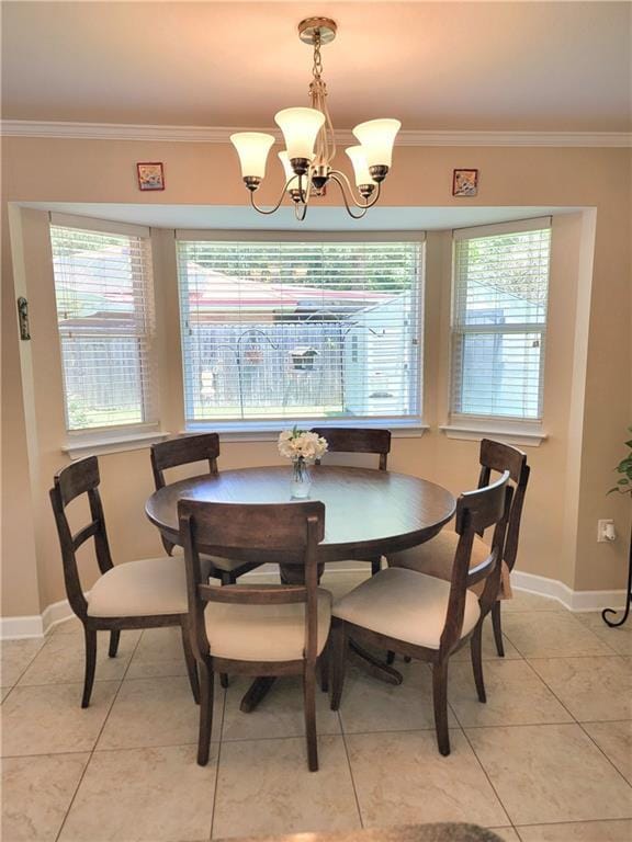 1207 Cousin St, Slidell, LA 70458 - dining space with a chandelier, plenty of natural light, ornamental molding, and light tile patterned floors