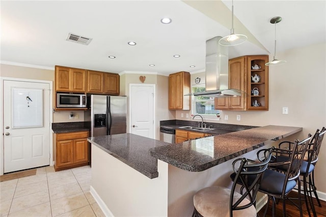 1207 Cousin St, Slidell, LA 70458 - kitchen with appliances with stainless steel finishes, brown cabinetry, extractor fan, crown molding, and a peninsula