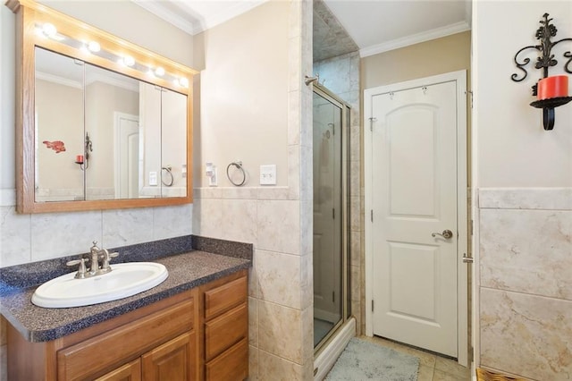 1207 Cousin St, Slidell, LA 70458 - bathroom with tile walls, crown molding, a shower stall, vanity, and a wainscoted wall