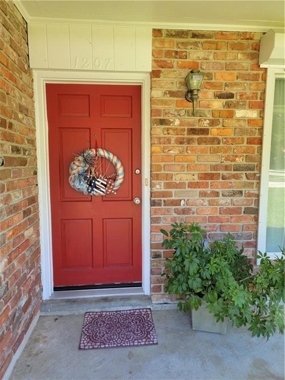 1207 Cousin St, Slidell, LA 70458 - doorway to property featuring brick siding
