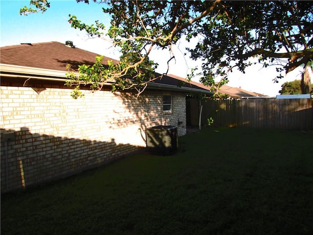 7812 Scottwood Dr, New Orleans, LA 70128 - view of side of property featuring brick siding and roof with shingles