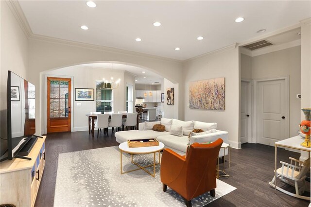110 Sharon Dr, New Orleans, LA 70124 - living area featuring arched walkways, ornamental molding, dark wood finished floors, baseboards, and recessed lighting