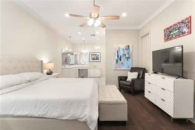 110 Sharon Dr, New Orleans, LA 70124 - bedroom with dark wood-style floors, recessed lighting, crown molding, connected bathroom, and a sink