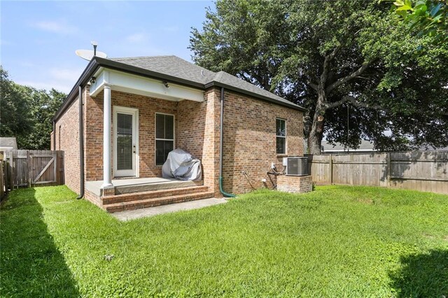 110 Sharon Dr, New Orleans, LA 70124 - rear view of property with brick siding, central air condition unit, and a shingled roof