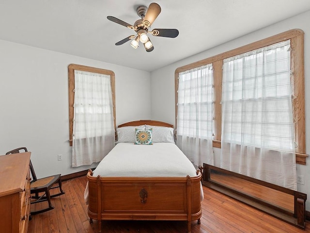 5525 Marshal Foch St, New Orleans, LA 70124 - bedroom with hardwood / wood-style floors, baseboards, and ceiling fan
