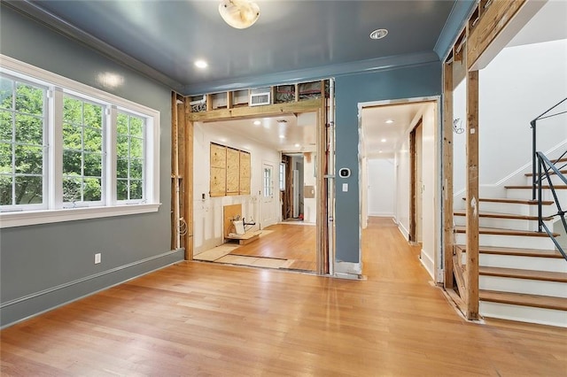 1215 Exposition Blvd, New Orleans, LA 70118 - entryway with light wood-style floors, ornamental molding, stairway, and baseboards