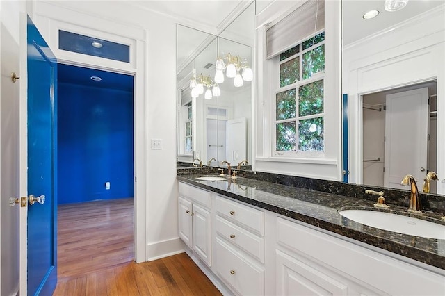 1215 Exposition Blvd, New Orleans, LA 70118 - full bath with double vanity, ornamental molding, wood finished floors, and baseboards