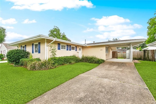 single story home with driveway and an attached carport