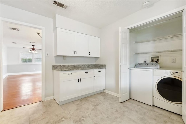 laundry area featuring independent washer and dryer, a ceiling fan, and baseboards