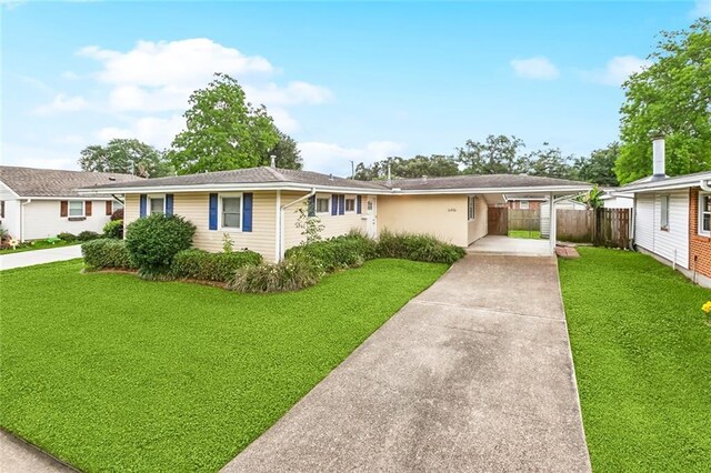 single story home featuring driveway and an attached carport