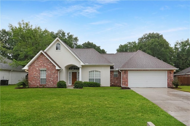 910 Crestwood Blvd, Covington, LA 70433 - traditional-style house with an attached garage, concrete driveway, a front yard, and brick siding