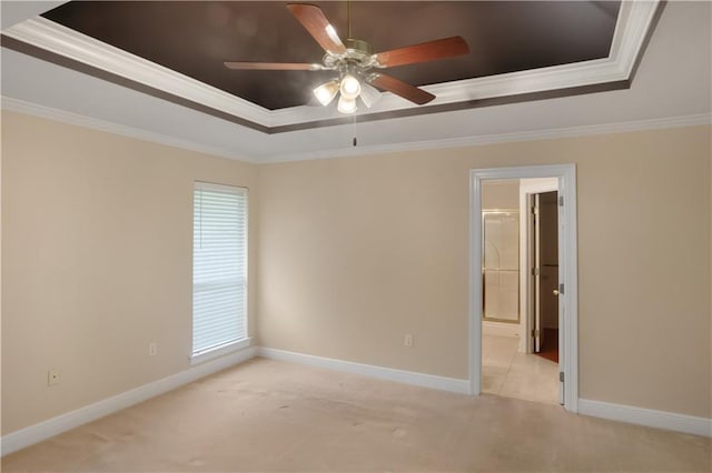 910 Crestwood Blvd, Covington, LA 70433 - unfurnished room featuring a raised ceiling, light carpet, ceiling fan, crown molding, and baseboards