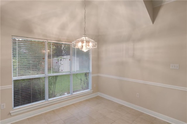 910 Crestwood Blvd, Covington, LA 70433 - unfurnished dining area featuring a chandelier, baseboards, and light tile patterned floors