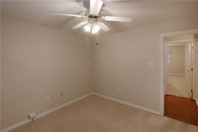 910 Crestwood Blvd, Covington, LA 70433 - empty room featuring light carpet, a ceiling fan, and baseboards