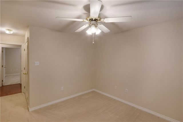 910 Crestwood Blvd, Covington, LA 70433 - empty room featuring light carpet, a ceiling fan, and baseboards
