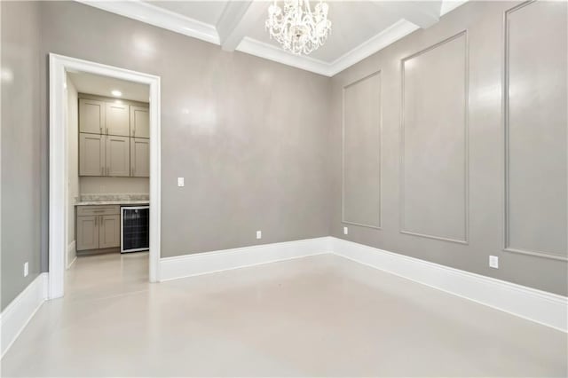 428 Hesper Ave, Metairie, LA 70005 - empty room with wine cooler, finished concrete floors, a chandelier, and crown molding