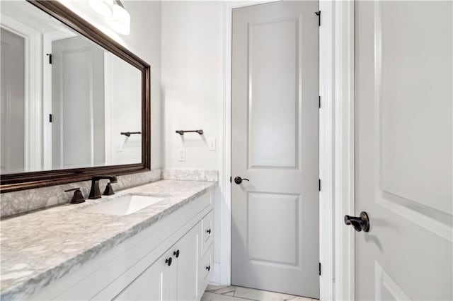 428 Hesper Ave, Metairie, LA 70005 - bathroom with marble look tiles and vanity