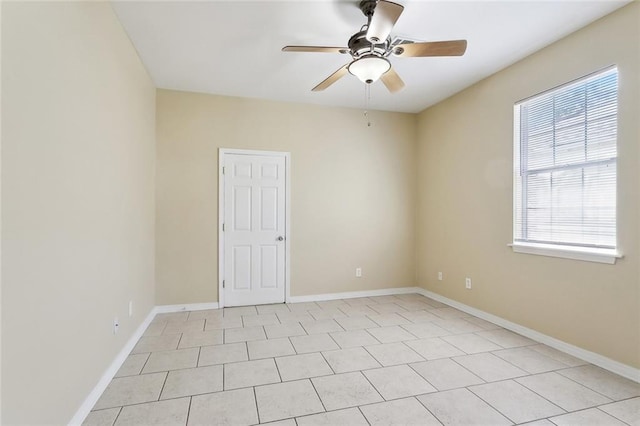 3725 Clermont Dr, New Orleans, LA 70122 - empty room with plenty of natural light, ceiling fan, and light tile patterned flooring