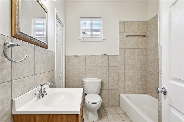 3725 Clermont Dr, New Orleans, LA 70122 - bathroom with tile walls, plenty of natural light, toilet, tile patterned flooring, and vanity