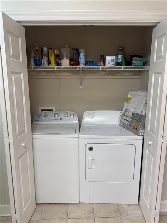710 E Boyd Dr Unit 906, Baton Rouge, LA 70808 - laundry area featuring independent washer and dryer and light tile patterned floors