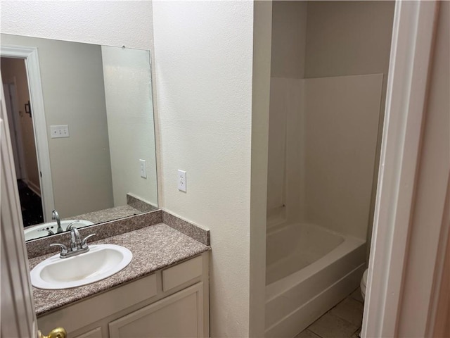 710 E Boyd Dr Unit 906, Baton Rouge, LA 70808 - full bath with tile patterned flooring, vanity, bathtub / shower combination, toilet, and a textured wall