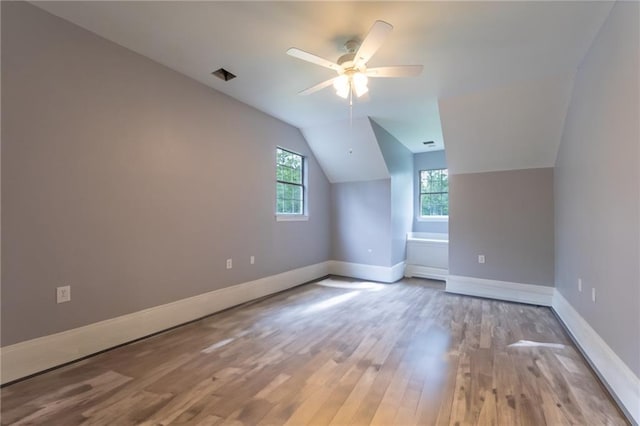 324 Salem Dr, Mandeville, LA 70471 - bonus room featuring wood finished floors, a ceiling fan, vaulted ceiling, and baseboards
