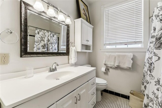 6817 Catina St, New Orleans, LA 70124 - full bathroom featuring vanity, toilet, and a shower with curtain