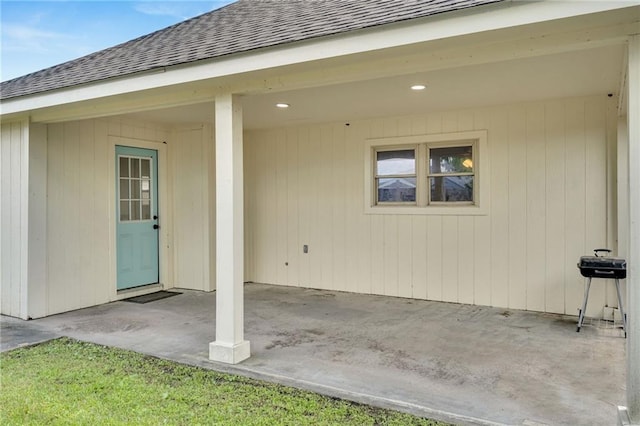 172 Winnona Dr, Westwego, LA 70094 - property entrance featuring roof with shingles and a patio