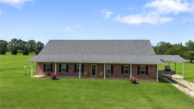 52125 Oak Ridge Dr, Franklinton, LA 70438 - view of front of house featuring dirt driveway, a front yard, roof with shingles, and a patio