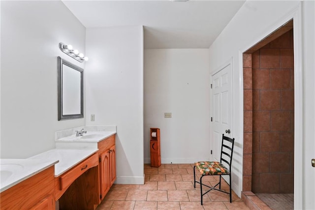 52125 Oak Ridge Dr, Franklinton, LA 70438 - bathroom featuring baseboards, double vanity, and tile patterned floors