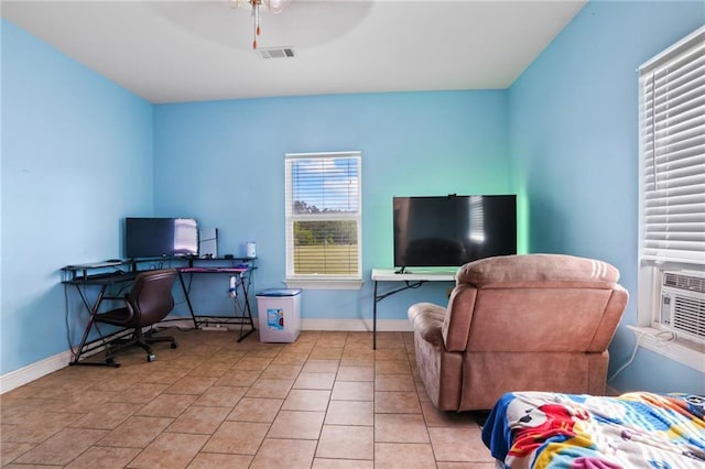 52125 Oak Ridge Dr, Franklinton, LA 70438 - home office featuring baseboards, a ceiling fan, and light tile patterned flooring