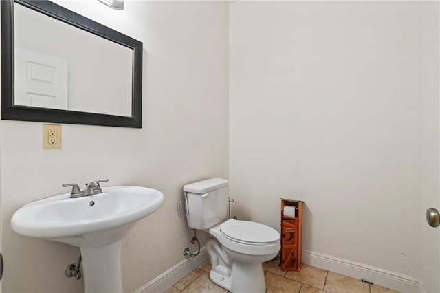 52125 Oak Ridge Dr, Franklinton, LA 70438 - half bath with baseboards, toilet, and tile patterned flooring