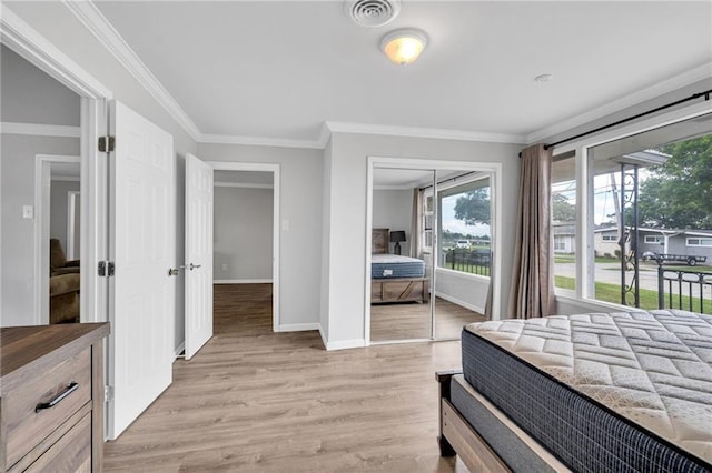 bedroom featuring light wood-style flooring, baseboards, crown molding, and access to exterior