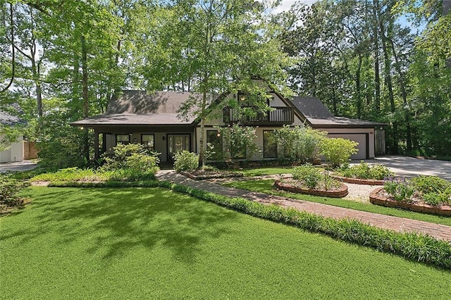 201 Natchez Pl, Mandeville, LA 70471 - view of front of house featuring driveway, a garage, and a front lawn