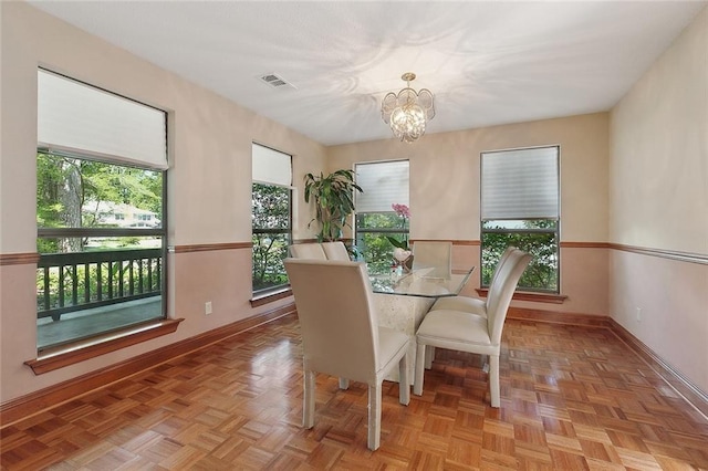 201 Natchez Pl, Mandeville, LA 70471 - dining space with plenty of natural light, a chandelier, and baseboards
