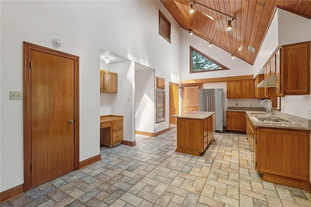 201 Natchez Pl, Mandeville, LA 70471 - kitchen with stainless steel appliances, wooden ceiling, under cabinet range hood, a center island, and high vaulted ceiling
