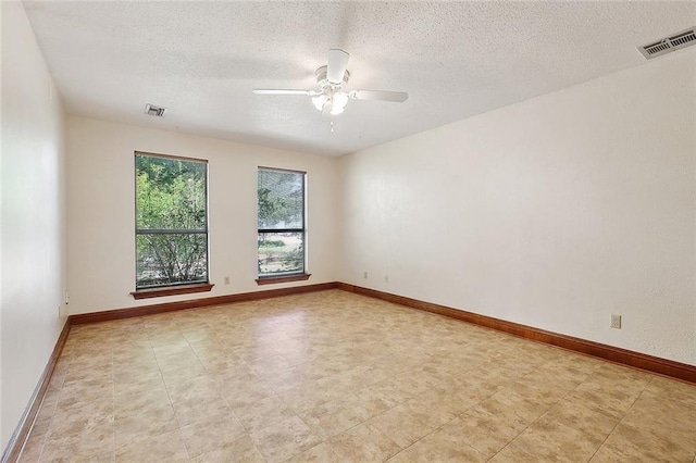 201 Natchez Pl, Mandeville, LA 70471 - unfurnished room with a ceiling fan, a textured ceiling, and baseboards