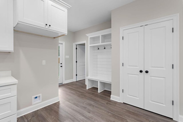 70405 9th St, Covington, LA 70433 - mudroom featuring dark wood-type flooring and baseboards