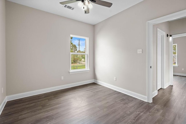 70405 9th St, Covington, LA 70433 - unfurnished room with a ceiling fan, dark wood-type flooring, and healthy amount of natural light