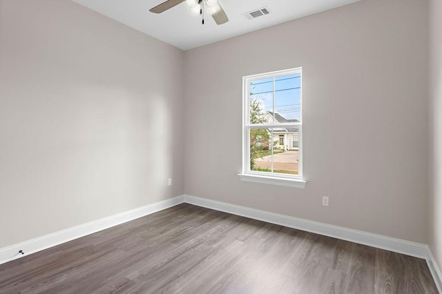 70405 9th St, Covington, LA 70433 - empty room with ceiling fan, dark wood-style flooring, and baseboards