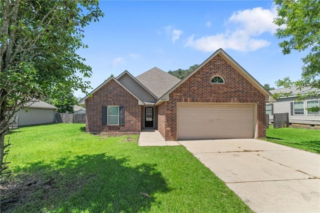 28475 Apple Blossom Ln, Ponchatoula, LA 70454 - traditional-style house featuring brick siding, a garage, and driveway