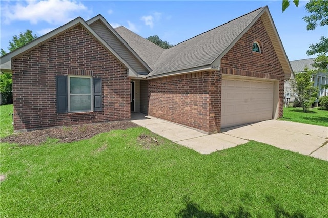 28475 Apple Blossom Ln, Ponchatoula, LA 70454 - ranch-style house featuring brick siding, a front yard, a shingled roof, and concrete driveway