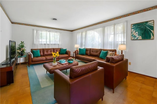 living area with crown molding