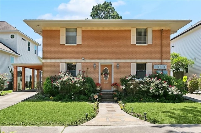 402 28th St, New Orleans, LA 70124 - view of front facade featuring brick siding, a front lawn, and entry steps