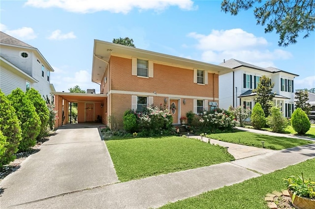 402 28th St, New Orleans, LA 70124 - view of front of house with brick siding, an attached carport, a front lawn, and driveway