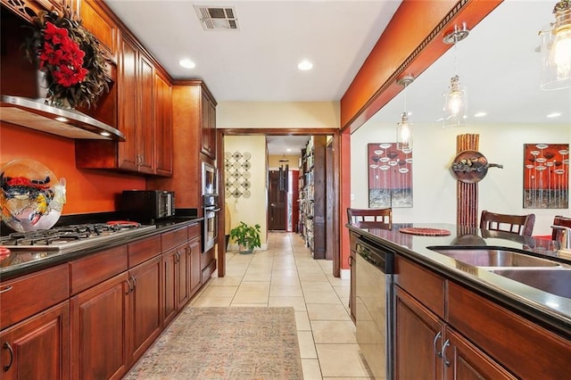 402 28th St, New Orleans, LA 70124 - kitchen featuring appliances with stainless steel finishes, dark countertops, light tile patterned floors, and recessed lighting