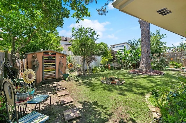 402 28th St, New Orleans, LA 70124 - view of yard featuring a storage unit and an outdoor structure
