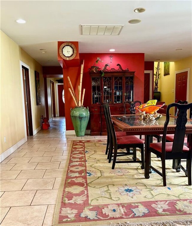 402 28th St, New Orleans, LA 70124 - dining area with baseboards, light tile patterned flooring, and recessed lighting